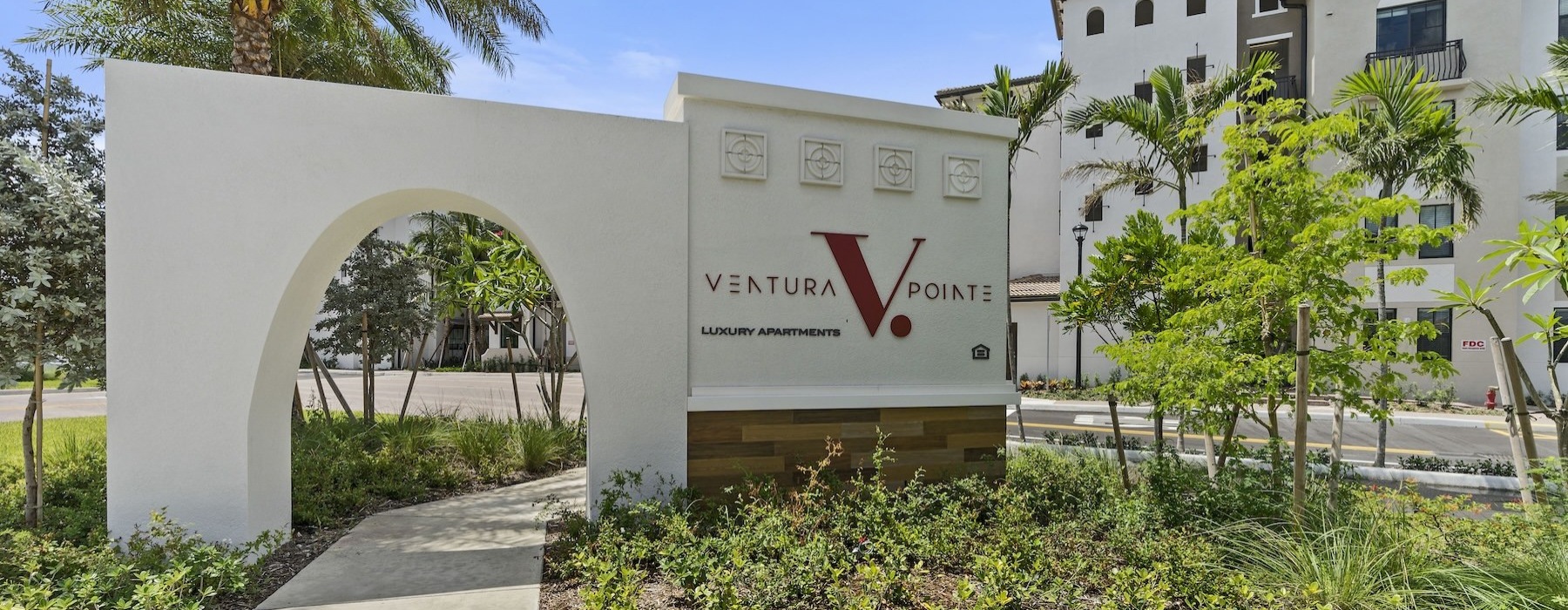 a white building with a sign on it